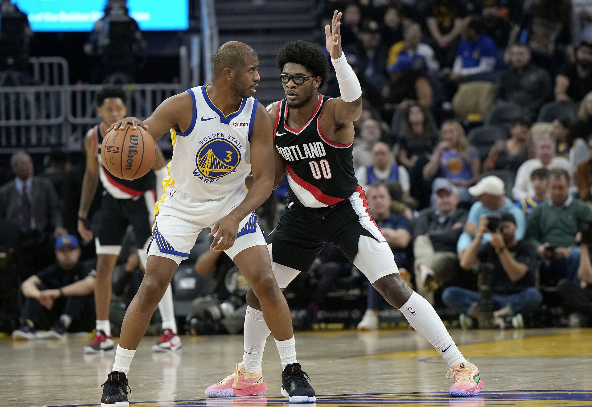 Scoot Henderson #00 of the Portland Trail Blazers guards Chris Paul #3 - Source: Getty